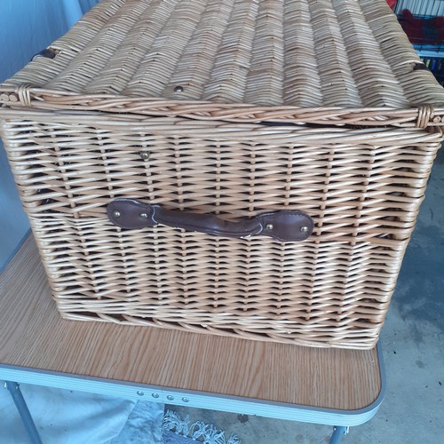 14 - Large lidded wicker basket. Leather handles and straps with buckles. Brass retaining chains for lid.... 