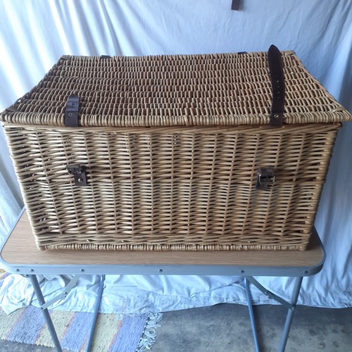 14 - Large lidded wicker basket. Leather handles and straps with buckles. Brass retaining chains for lid.... 