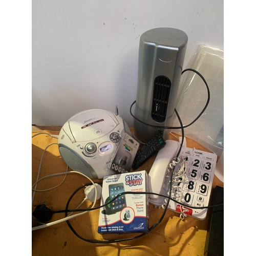 141 - Mixed Electrical lot including Stick and Stay tablet stand, Robert Radio, Homebase tower fan, etc