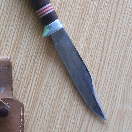 4 - Stainless steel blade in sheath. Solid piece. Minor wear.