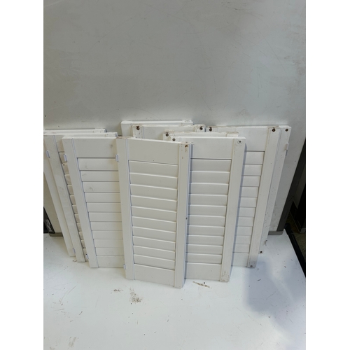 424 - Quantity of white window shutters