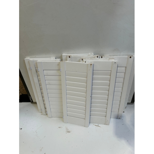 424 - Quantity of white window shutters