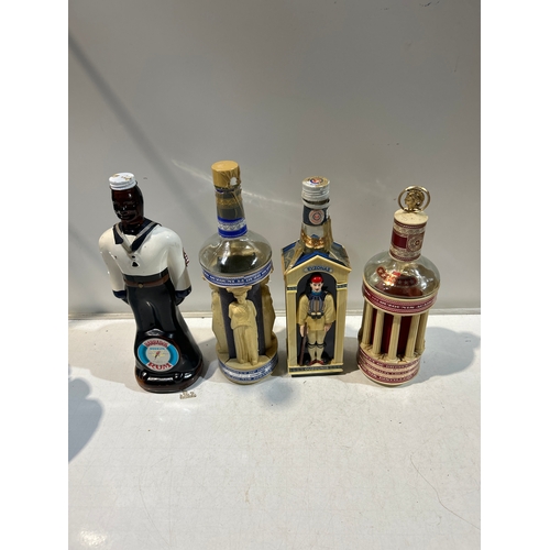 251 - 4x collectible bottles of alcohol (empty) inc Barbados rum and Ouzonis