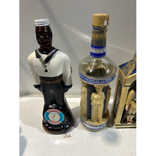 251 - 4x collectible bottles of alcohol (empty) inc Barbados rum and Ouzonis