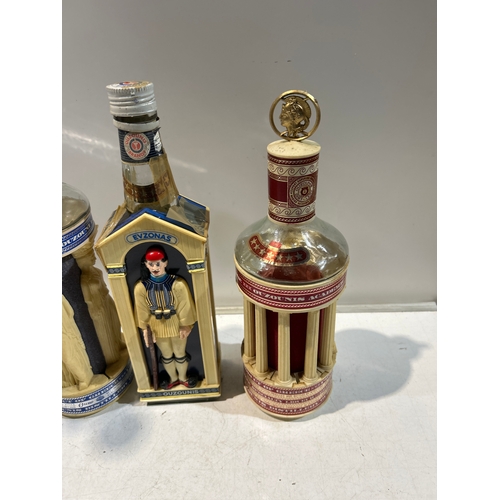 251 - 4x collectible bottles of alcohol (empty) inc Barbados rum and Ouzonis