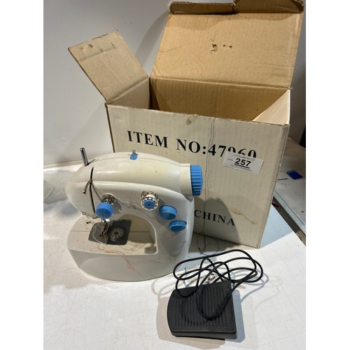 257 - Boxed mini sewing machine