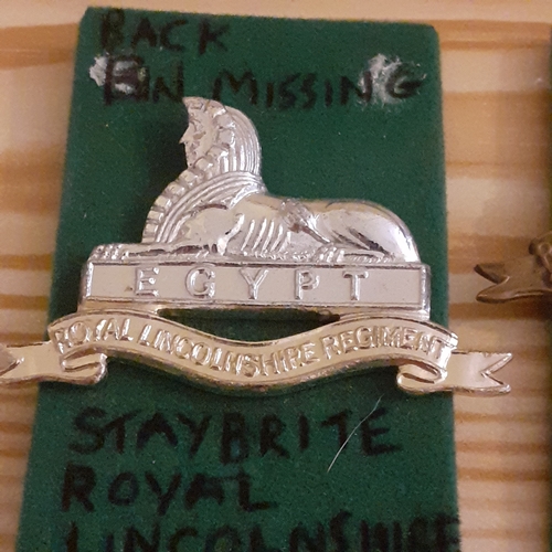 56A - Military Cap badges. The Lincolnshire Regt. One Brass/Metal and one Staybrite. Staybrite has no back... 