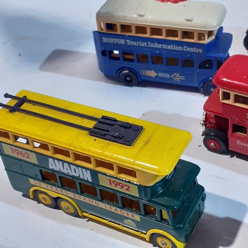 133A - Quantity of diecast buses and trams. Dusty but overall good condition.