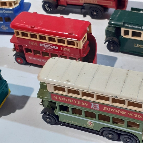 133A - Quantity of diecast buses and trams. Dusty but overall good condition.