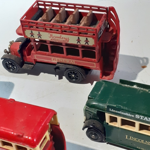 133A - Quantity of diecast buses and trams. Dusty but overall good condition.