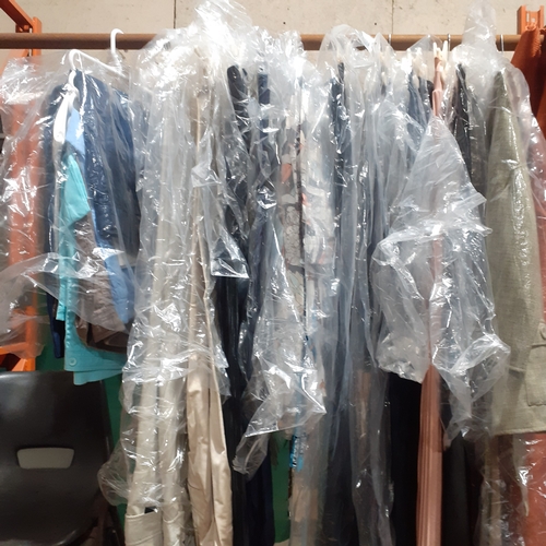 129A - Rail full of ladies trousers. Different styles and sizes. Some hangers have several pairs on them. N... 