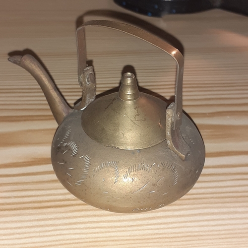 144A - Metal items. Cast iron weighing scales, vintage mincer and small Indian brass teapot.