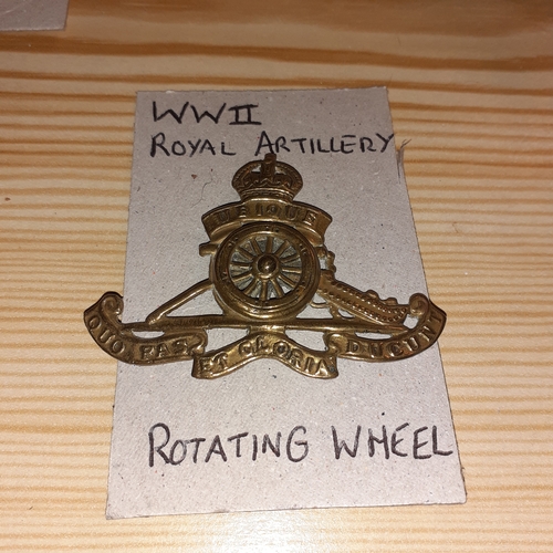 147A - Wartime Royal Artillery military cap badge. Rotating wheel in good condition