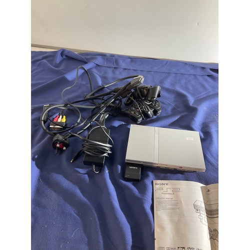 40 - Sony silver PS2 slim console with controllers and leads