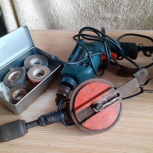 16 - Black and Decker drill, model KD562 - working - plus a vintage hand drill and a tin of various tape.