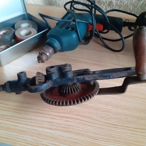 16 - Black and Decker drill, model KD562 - working - plus a vintage hand drill and a tin of various tape.