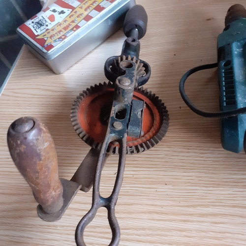 16 - Black and Decker drill, model KD562 - working - plus a vintage hand drill and a tin of various tape.