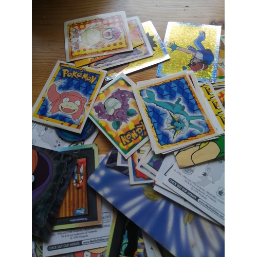 52B - Pokemon collection including cards and badges