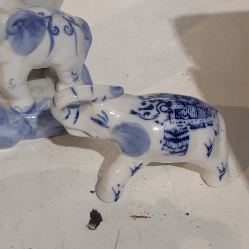 29 - Family of blue/white porcelain elephants. Great looking detail and no damage.