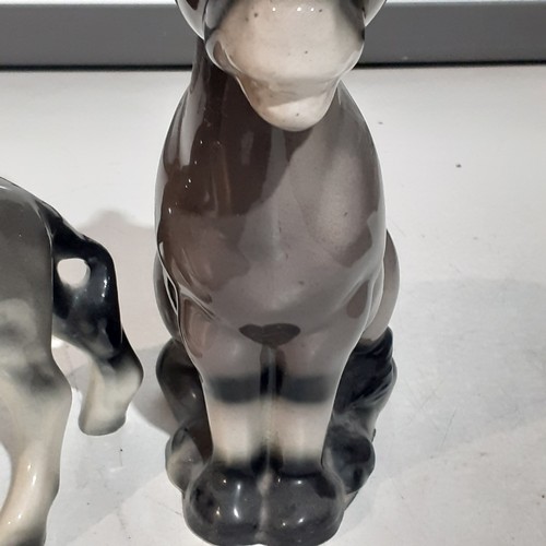 23 - 2 x cute porcelain donkeys. Lovely features with no damage. Large one approx 10 inches