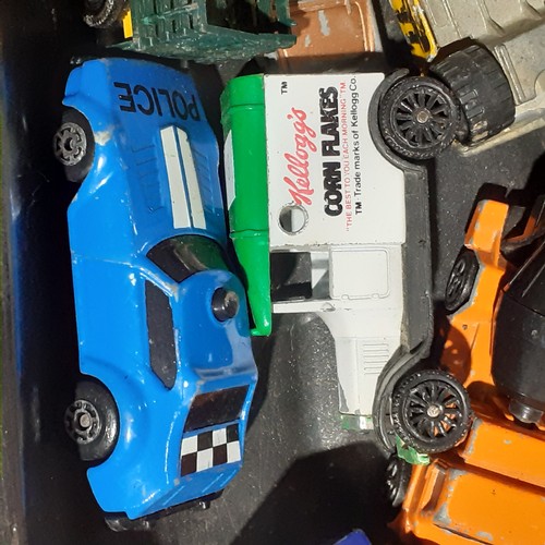 20 - Diecast lot including Red Double Decker Teamsters Bus unopened and other various cars and tricks on ... 