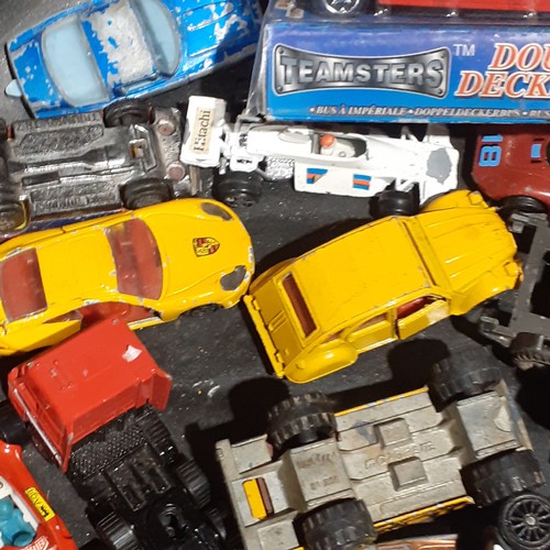 20 - Diecast lot including Red Double Decker Teamsters Bus unopened and other various cars and tricks on ... 