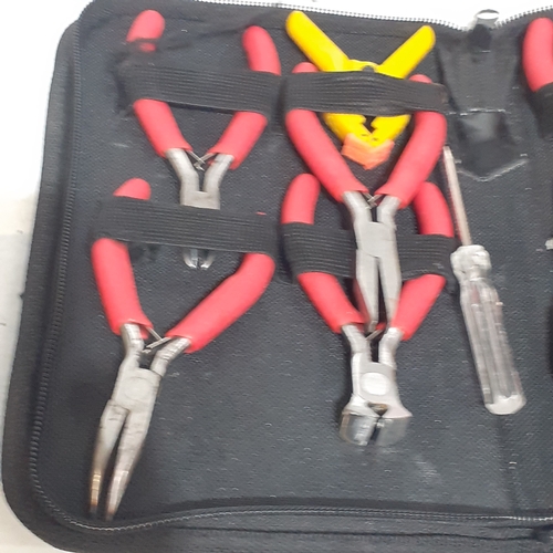 456A - Canvas carry case containing different size and grip pliers. Look as if they have had little use.