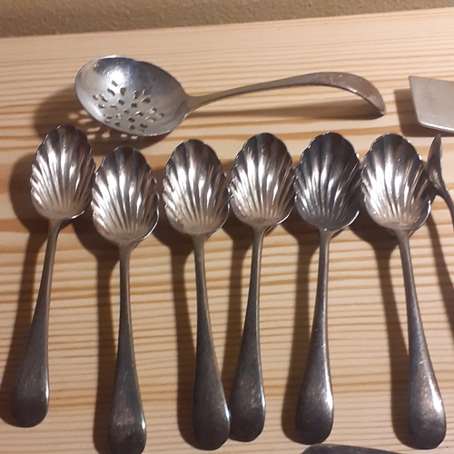 109A - Mixed Cutlery. Includes sugar spoons and sugar tongs, forks with mother of pearl looking handles, br... 