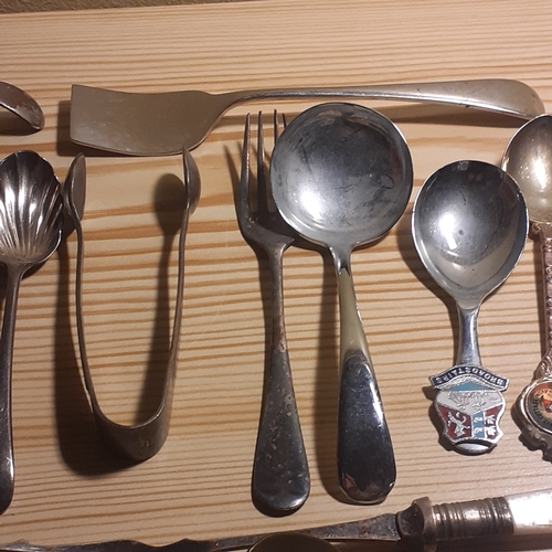 109A - Mixed Cutlery. Includes sugar spoons and sugar tongs, forks with mother of pearl looking handles, br... 