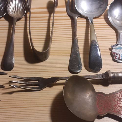 109A - Mixed Cutlery. Includes sugar spoons and sugar tongs, forks with mother of pearl looking handles, br... 