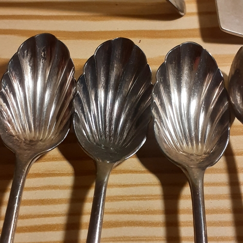 109A - Mixed Cutlery. Includes sugar spoons and sugar tongs, forks with mother of pearl looking handles, br... 