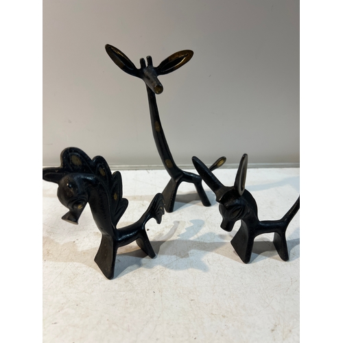 95 - Trio of ebonised brass sculptures