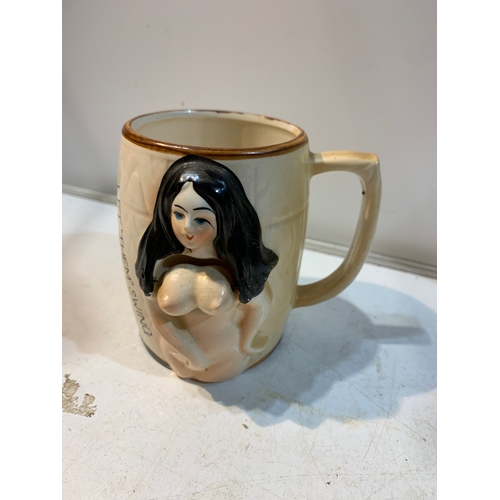 147 - Novelty ‘let them swing’ mug with rotating ladies chest