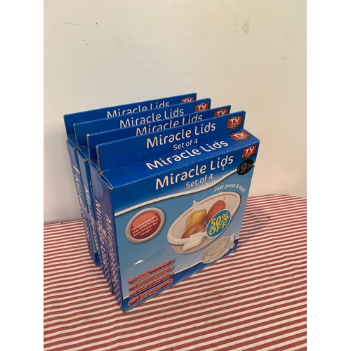 556 - Boxed set of 4 miracle lids