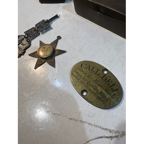 184 - Collectible lot inc small desk day calendar, medals, brass call bell and small metal pin box