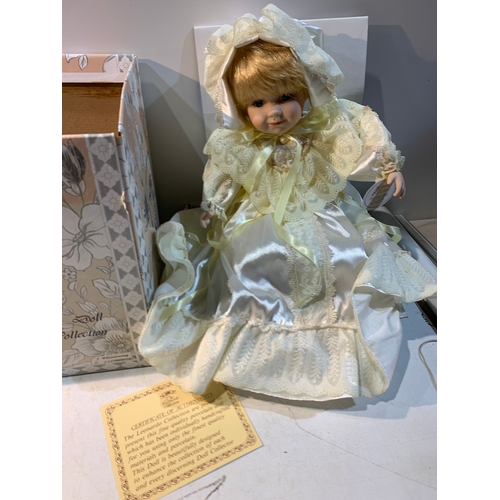 259 - Sitting porcelain doll from the Leonardo collection with box and certificate