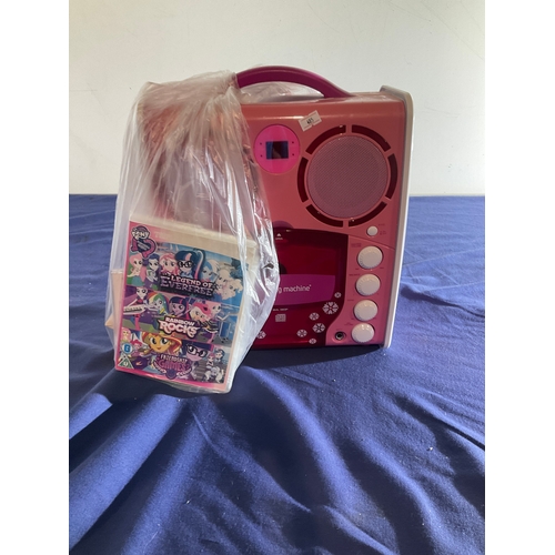 82 - Singing machine portable CD+G karaoke player with a selection of CDs