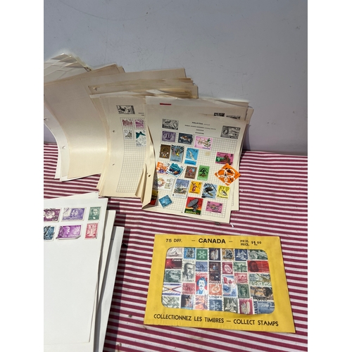 156A - Large quantity of stamps from around the world inc Malaysia, Canada and more