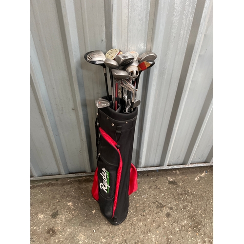 559 - Golf clubs in case inc Taylor Made & Daiwa