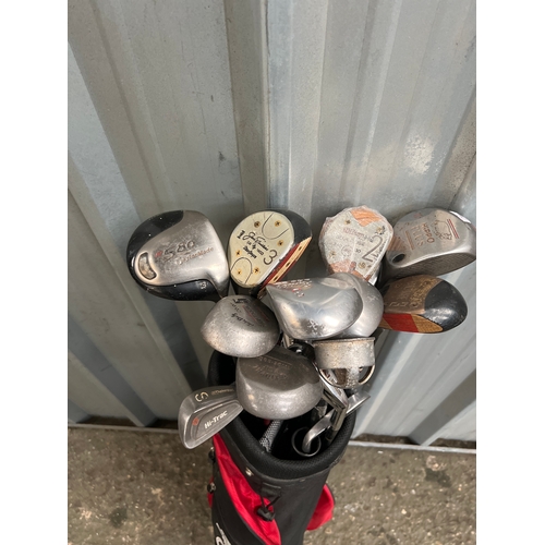 559 - Golf clubs in case inc Taylor Made & Daiwa