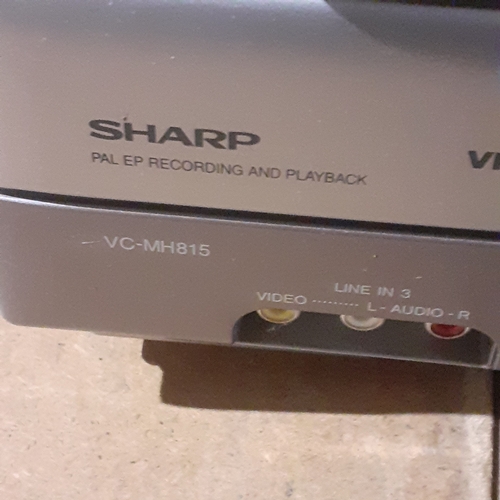 123A - Sharp Video Cassette Recorder with remote control. Model VC-MH815. Working order