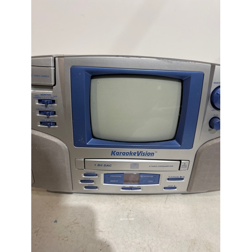 133 - The singing machine karaoke machine with small CRT tv built in