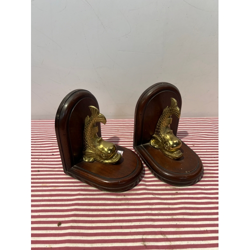 544 - Pair of wooden bookends with brass fish