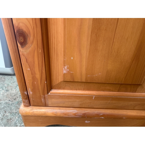 525 - Pine Glass Cabinet with cupboard and three glass shelves in good condition.