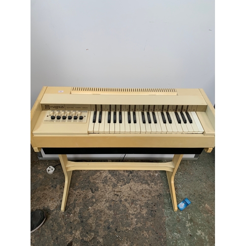 423 - Magnus Electric Chord Organ on plastic stand