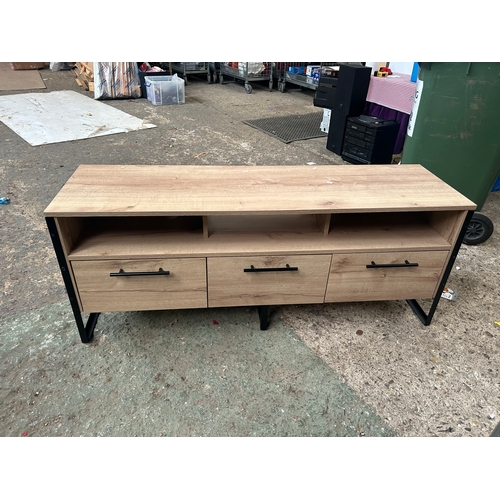 408 - Modern TV Stand with three drawers. In good condition