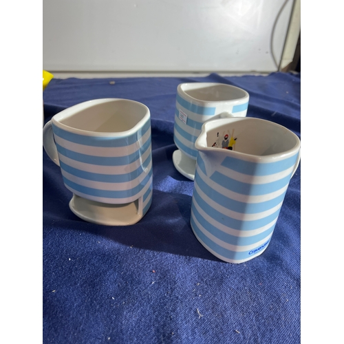 194 - Cravendale teapot with milk jug and 2 mugs with biscuit holders