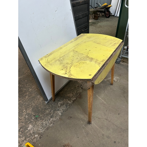 300A - Yellow formica drop leaf table