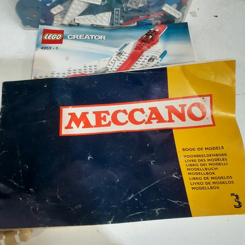 21B - Tub of random Meccano and Lego bits mixed plus a Lego and Mecano booklet. Includes part built plane ... 