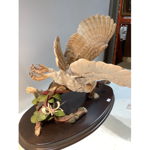 3 - Large owl on branch by country Artists on wooden plinth in excellent condition - 45cm width